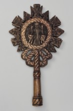 Processional cross, Ethiopian workshop. In the center of the cross, in the tondo, a standing man is