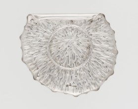 Jam or honey container stand in the shape of a stylized leaf, rolled up on one side, with wavy