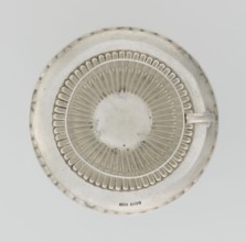 Hemispherical cup and saucer, decorated with radiating curls to half the cup's height, with a
