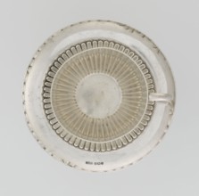 Hemispherical cup and saucer decorated with radiating curls to half its height; C-shaped side