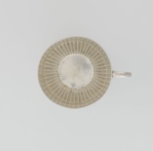 Hemispherical cup and saucer, decorated with radiating curls to half its height, with a C-shaped