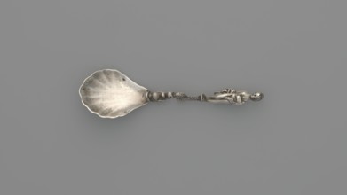 Decorative silver spoon with a shell-shaped scoop and handle formed by a solid dolphin supporting a