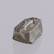 Jewellery die, Approximately hexagonal die with a relief rectangular reserve enclosed at the ends