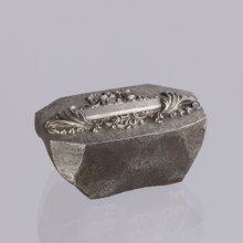 Jewellery die, Approximately hexagonal die with a relief rectangular reserve enclosed at the ends