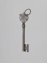 Key, locksmithing, rosette ornament. A Venetian-type key with a smooth tubular shaft, a feather
