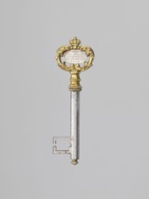 Souvenir key, steel, with a full shank, with a simple feather in the form of two square brackets.