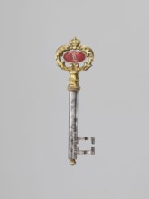 Souvenir key, steel, with a full shank and a simple feather in the form of two square brackets.