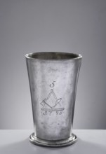 Bricklayers' guild mug. Tin mug of conical shape, set on a profiled convex base with a turned-down