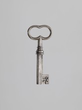 Key, locksmithing. Key with a tubular shaft with a Greek cross cross-section, with a feather