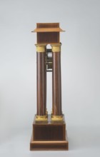 Mantel clock by Alexandre Pertrand fl. ca. 1840. Mantel clock in the form of a four-column portico