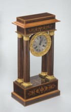 Mantel clock by Alexandre Pertrand fl. ca. 1840. Four-column portico form on a cuboid base and