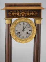 Mantel clock by Alexandre Pertrand fl. ca. 1840. Four-column portico form on a cuboid base and