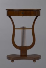 Oval display table with lyre-shaped base mounted on a platform with a concave-convex outline,