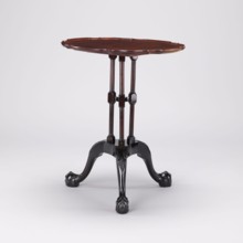 Table, SIDE TABLE with a round top with a wavy, profiled rim, supported by a shaft composed of