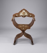 Scissor chair, Scissor armchair made of eight pairs of crossed S-shaped slats, connected at the