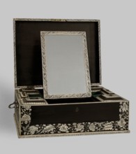 Travel dressing table, Baroque style, ca. 1750, Vizagapatam, India. Ebony cuboid with a lifting lid