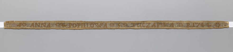 Gallon, galloons haberdashery; woven inscription: brown letters on a silver background; parallel to