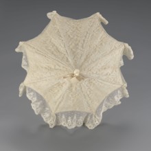 Women's umbrella made of white lace. Its canopy is trimmed with cream silk at the bottom, which