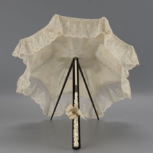 Umbrella, women's umbrella made of white lace. Canopy trimmed with cream silk at the bottom,