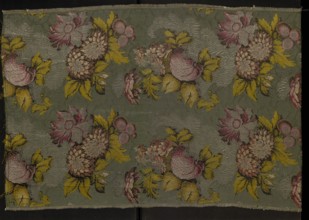 Fragment of patterned silk fabric, 18th century, France. Plant and floral-and-fruit design in a