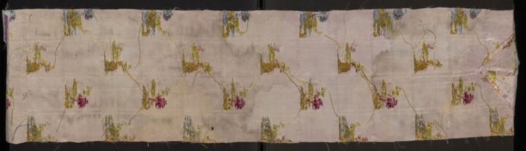 Fragment of pale pink silk fabric brocaded with colorful threads and silver thread. Brocade
