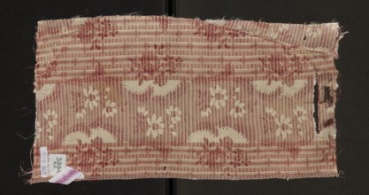 Fabric fragment, silk, patterned floral design. Main motif: wide, winding white satin ribbon with