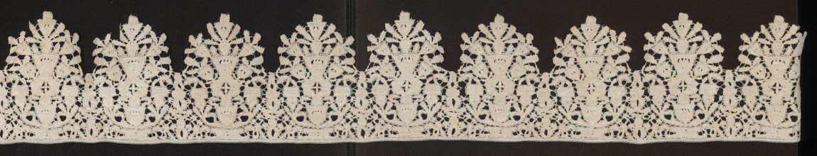 Lace fragment, Floral ornaments; lower edge serrated. In each oval there is a vase of flowers.