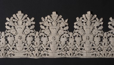 Lace fragment, Floral ornaments. Lace, lower edge serrated. In each oval there is a vase of