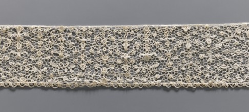 Lace fragment, lace with a fine floral pattern; de brides background with picots; lower edge with