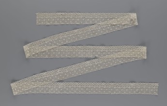 Lace fragment, lace. Edge ornament on one side — a kind of net with numerous loops, small round and
