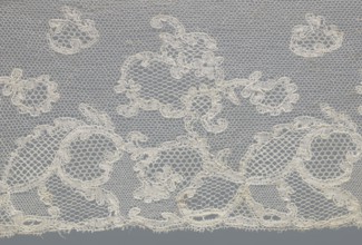 Fragment of lace, lace. Inside the motifs there are varied mesh backgrounds: drochel, ißsgrond, and