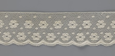 Lace fragment, tied in the form of a belt with one-sided arched serrations. Regular ornament: