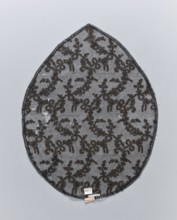 Lace, plant ornaments, in the shape of an oval pointed on one side. A narrow strip of geometric