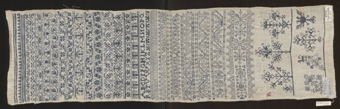 Embroidery sampler, Sampler with a cross-stitch pattern of trails, flower bushes, and letters. Blue