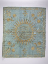 Church napkin. Blue silk rep cloth embroidered with gold thread. In the center, within a radiant