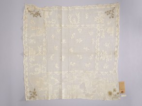 Tablecloth., Embroidered tablecloth: white embroidery on white mesh. In the center are projections
