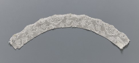 Lace fragment, Binche lace, slightly rounded in shape. The lower edge is slightly serrated, the