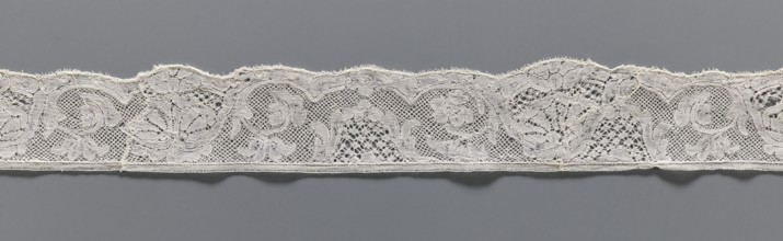 Lace fragment, lace, mesh background with rounded meshes. The lower edge is slightly serrated. The