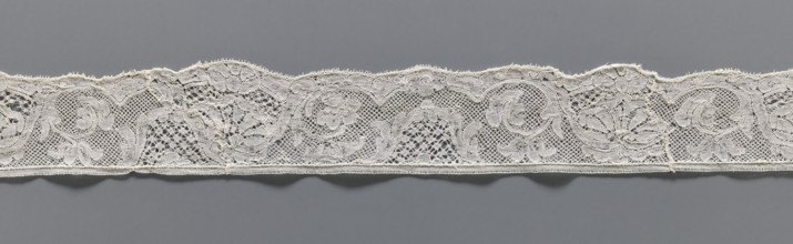 Lace fragment, lace, mesh background with rounded meshes. The lower edge is slightly serrated. The
