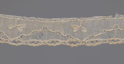 Lace fragment, needle-stitched lace, highly elongated openwork ovals. Above the edge ornament,