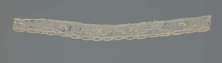 Lace fragment, needle-stitched lace, highly elongated openwork ovals. Above the edge ornament,