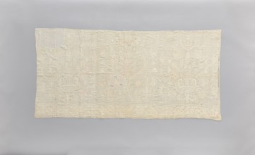 Church napkin made of white linen, covered with white, partially openwork embroidery. In the center