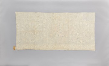 Church napkin made of white linen, covered with white, partially openwork embroidery. In the center