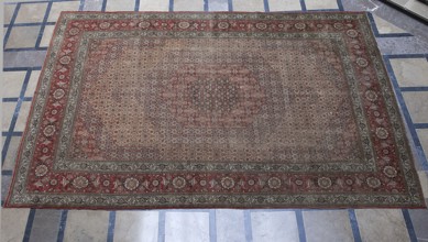 Carpet, In the center are four hexagonal medallions, one inside the other. Their interiors and the