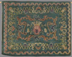 Kilim, In the center of the main field is a shield composed of ogee and rooster combs – the Wolda