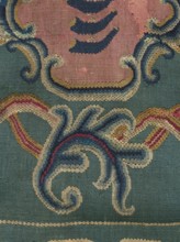 Kilim, In the center of the main field is a shield composed of ogee and rooster comb motifs — the