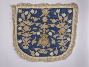 A hood from a church cope. The hood of the liturgical cope is made of navy blue silk with appliquéd