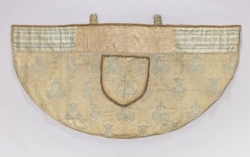 Church cope of silver brocade with Chinese motifs. Pretext sewn from two Polish fabrics—cream satin