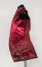Men's vest made of cherry satin, embroidered. Straight cut, sleeveless and collarless. Diagonal