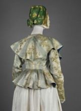 Women's caraco women's bodice, 1770s, Europe. Cream and blue silk brocaded with rose branches and